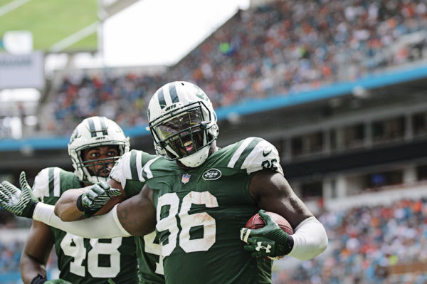 Muhammad Wilkerson (96) celebrates his interception he returned for a touchdown
