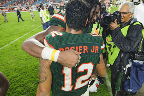 Malik Rosier and Darrell Langham hug after the game