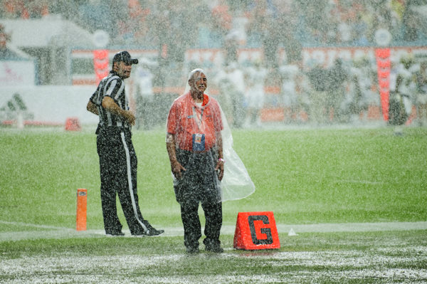 Security working in the rain delay