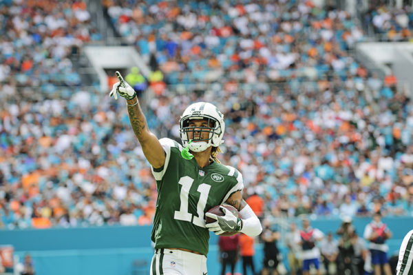 Robby Anderson (11) points to the crowd after his touchdown