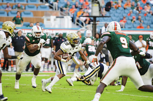 TaQuon Marshall (16) tries to find a running lane among defenders