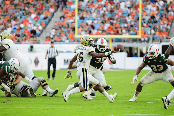 TaQuon Marshall (16) throws a shovel pass