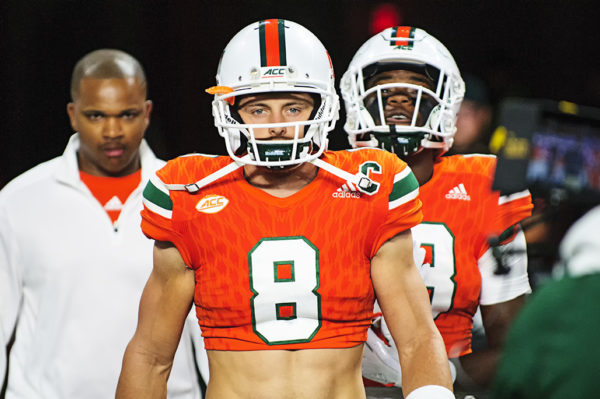 Braxton Berrios (8) is all business coming out of the tunnel