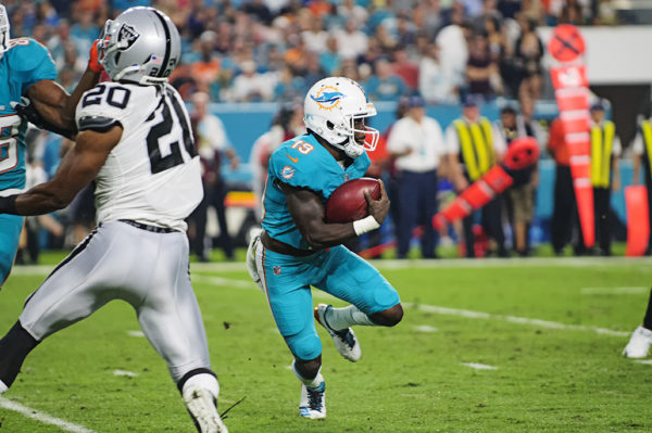 Jakeem Grant (19) tries to find a hole to run through on a kickoff return
