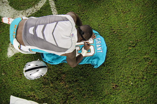 Jakeem Grant (19) writes a message on his jersey