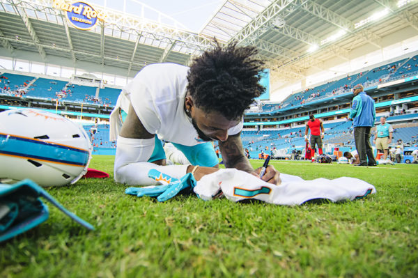 Jarvis Landry signs his jersey