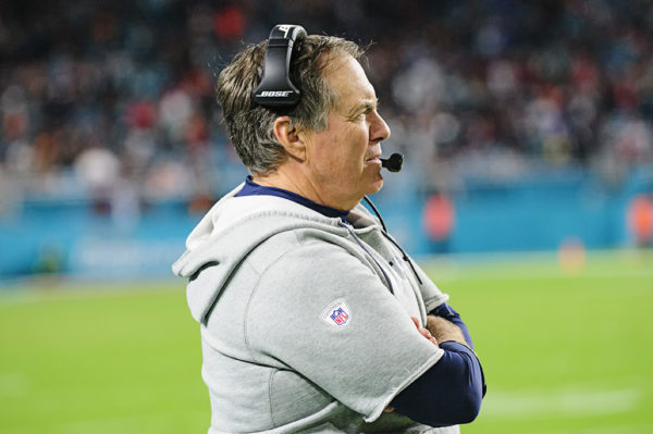 Bill Belichick watches the play