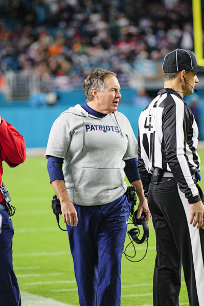 Bill Belichick gives the official his thoughts on a previous play