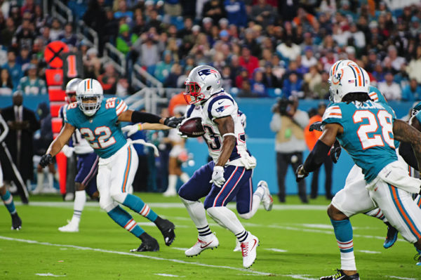 Dion Lewis (33) tries to find room to run
