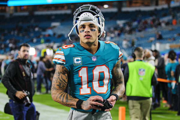 Dolphins WR, Kenny Stills, walks to the stands to give fans his gloves