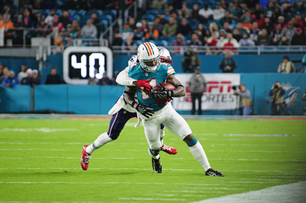 Malcolm Butler tackles Jarvis Landry (14) from behind