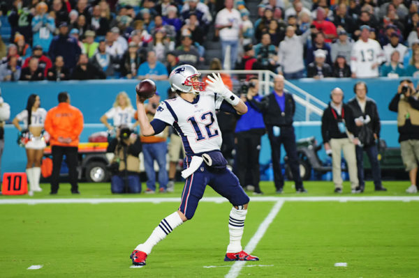 Tom Brady gears up to throw the ball