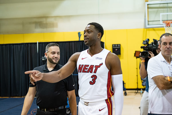 Dwyane Wade looks for media members to give out his Wade Wine to