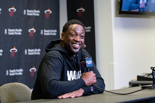 Dwyane Wade laughs retelling a story to the media