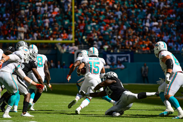 Miami Dolphins wide receiver Albert Wilson (15) finds a hole that springs him towards a touchdown