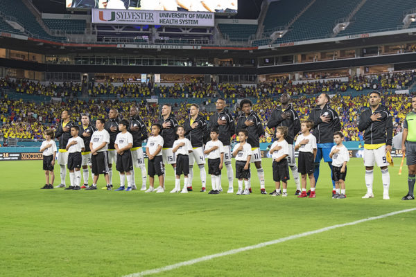 Colombia players singing their national anthem