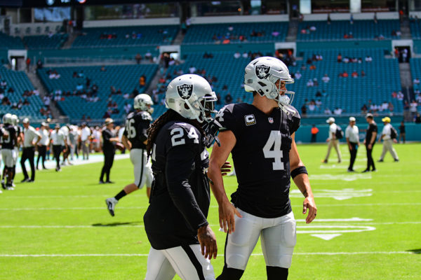 Oakland Raiders quarterback Derek Carr (4) and Oakland Raiders running back Marshawn Lynch (24)