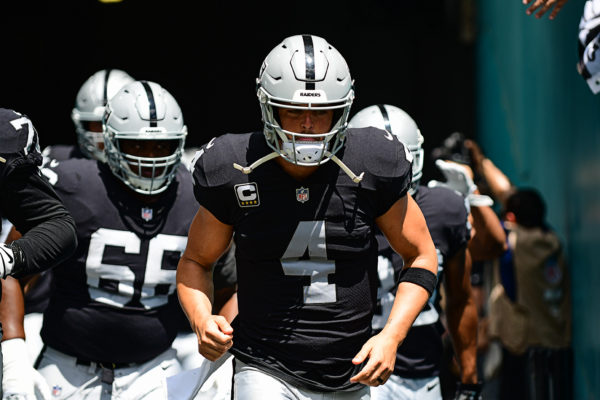 Oakland Raiders quarterback Derek Carr (4) leads the team out onto the field