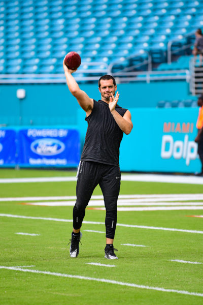 Oakland Raiders quarterback Derek Carr (4) warms up