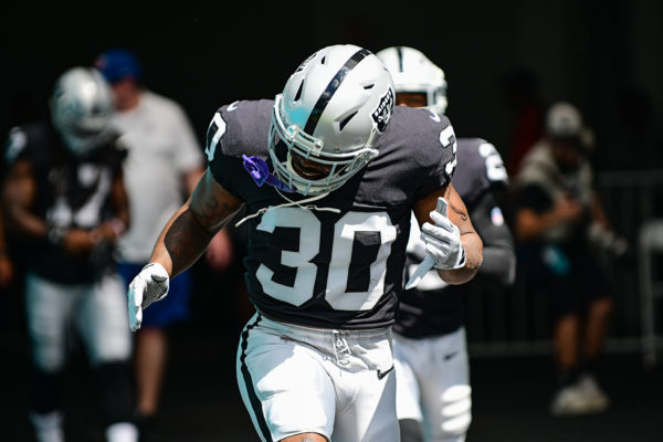 Oakland Raiders running back Jalen Richard (30) runs out to the field