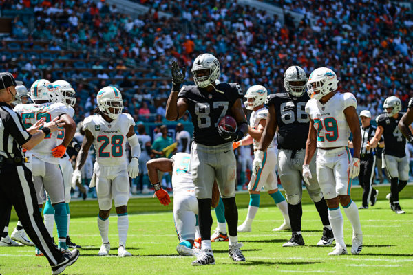 Oakland Raiders tight end Jared Cook (87) signals 1st down