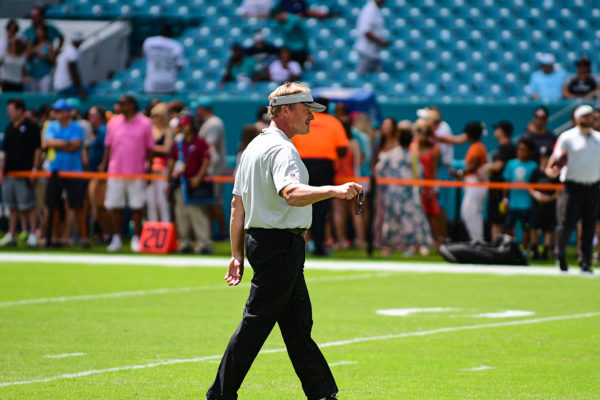 Oakland Raider head coach Jon Gruden acknowledges the Raider fans