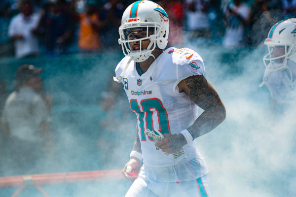 Miami Dolphins wide receiver Kenny Stills (10) emerges from the smoke