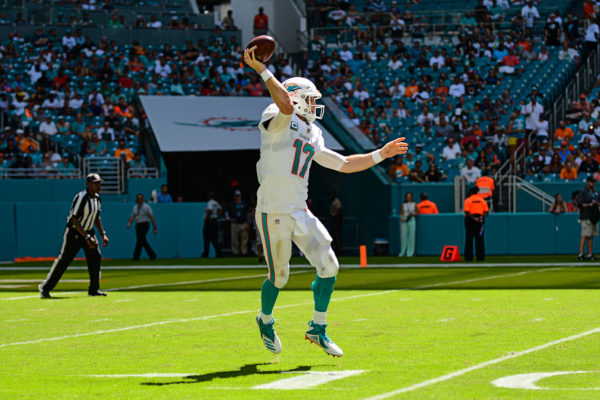 Miami Dolphins quarterback Ryan Tannehill (17) throws on the run