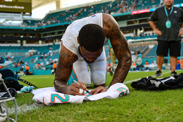 Miami Dolphins cornerback Xavien Howard (25) writes a message on his jersey