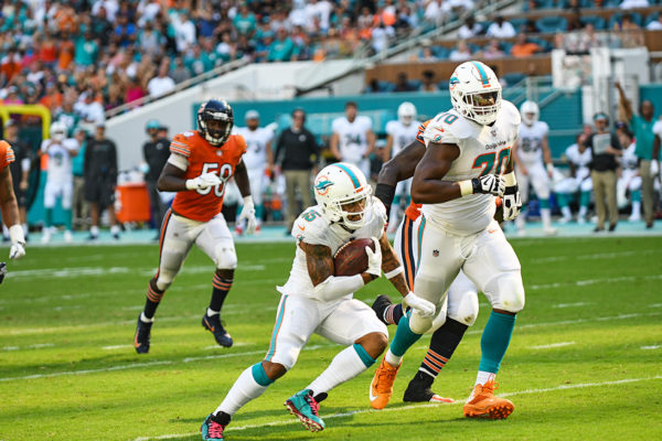 Miami Dolphins wide receiver Albert Wilson (15) cuts through the defense on his way to a touchdown