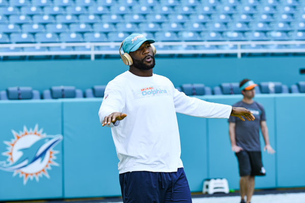 Miami Dolphins defensive end Andre Branch (50) enjoys his music during stretching
