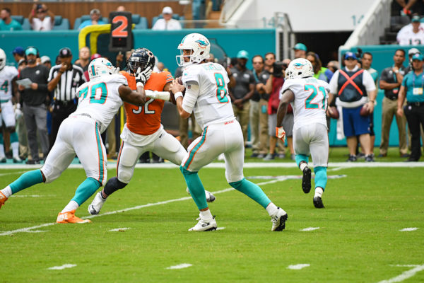Miami Dolphins quarterback Brock Osweiler (8) stands in the pocket