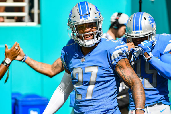 Detroit Lions free safety Glover Quin (27) is all smiles as he walks onto the field