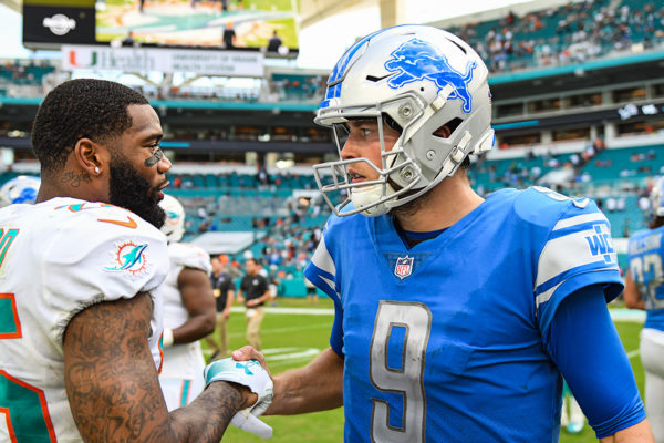 Detroit Lions quarterback Matthew Stafford (9) and Miami Dolphins cornerback Xavien Howard (25) after the game