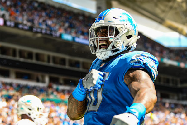 Detroit Lions tight end Michael Roberts (80) bangs on his chest after his touchdown catch