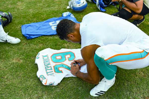 Miami Dolphins free safety Minkah Fitzpatrick (29) signs his jersey after the game