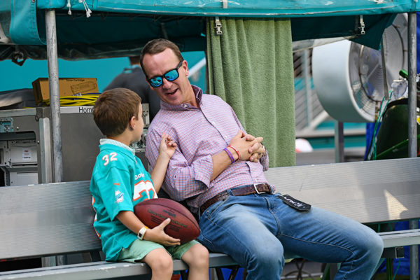 NFL great, Peyton Manning, spends some quality time before the game with his son