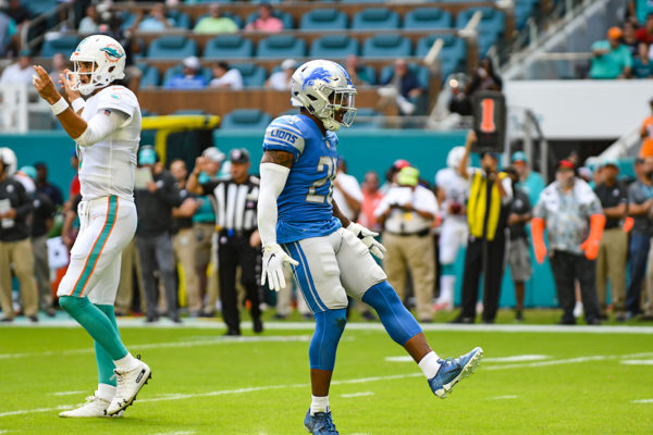 Detroit Lions strong safety Quandre Diggs (28) celebrates stopping the run