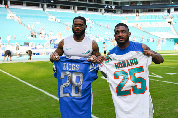 Miami Dolphins cornerback Xavien Howard (25) and Detroit Lions strong safety Quandre Diggs (28) exchange jerseys