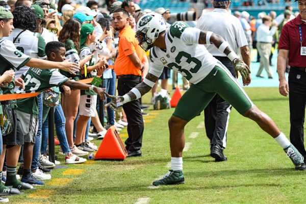 New York Jets strong safety Jamal Adams (33) reaches out to a fan during drills