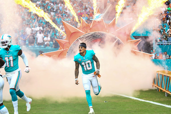 Miami Dolphins wide receiver Kenny Stills (10) runs through the smoke