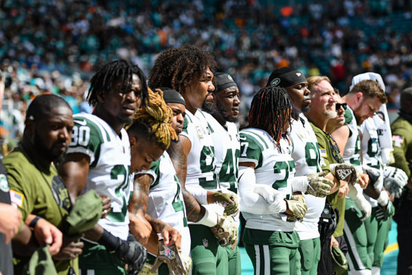 New York Jets line up for the national anthem