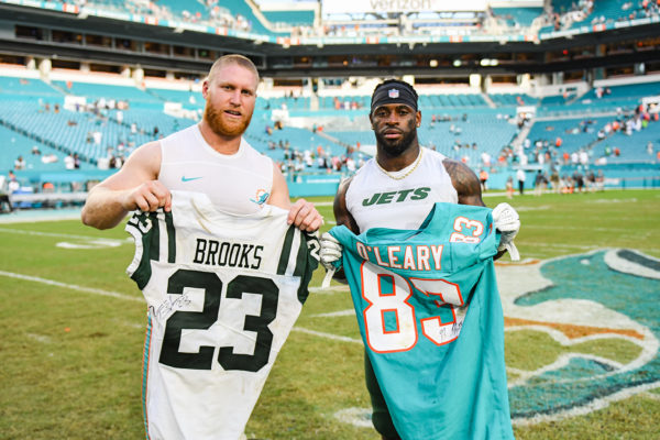 Miami Dolphins tight end Nick O'Leary (83) and New York Jets defensive back Terrence Brooks (23)
