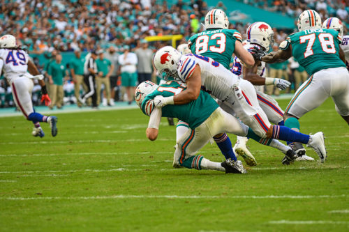 Buffalo Bills outside linebacker Lorenzo Alexander (57) sacks Miami Dolphins quarterback Ryan Tannehill (17)