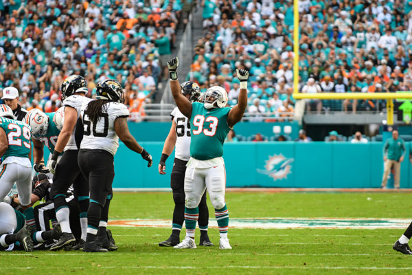 Miami Dolphins defensive tackle Akeem Spence (93) celebrates a fumble recovery