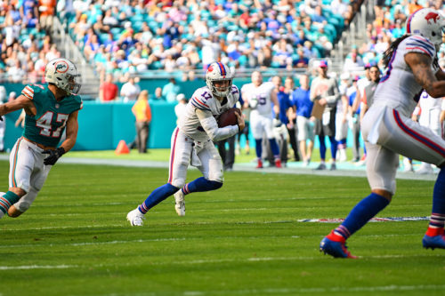 Buffalo Bills quarterback Josh Allen (17) runs past Miami Dolphins outside linebacker Kiko Alonso (47)