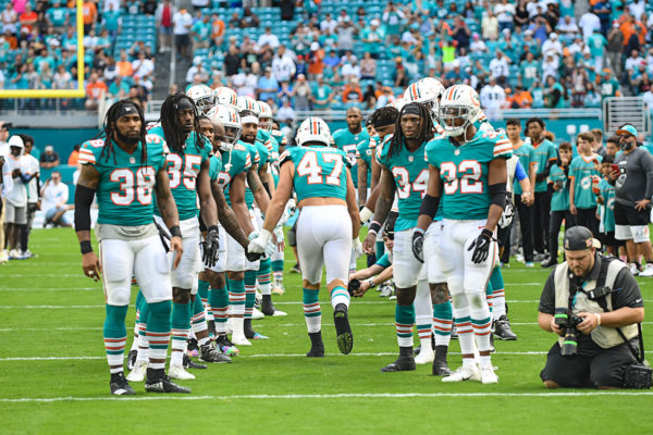 Miami Dolphins outside linebacker Kiko Alonso (47) high fives teammates