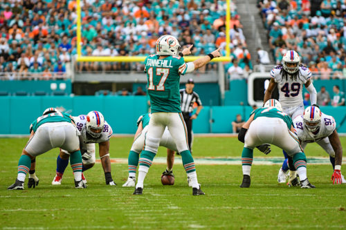 Miami Dolphins quarterback Ryan Tannehill (17) points out the defense