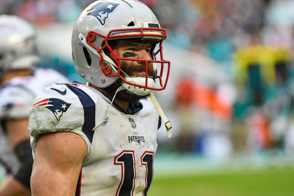 New England Patriots wide receiver Julian Edelman (11) smiles on the way to the bench