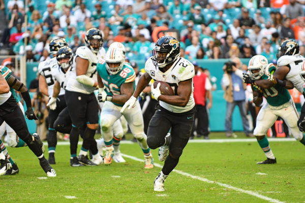 Jacksonville Jaguars running back Leonard Fournette (27) finds some room to run